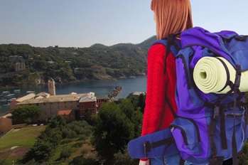 A traveler with a large bag on her back