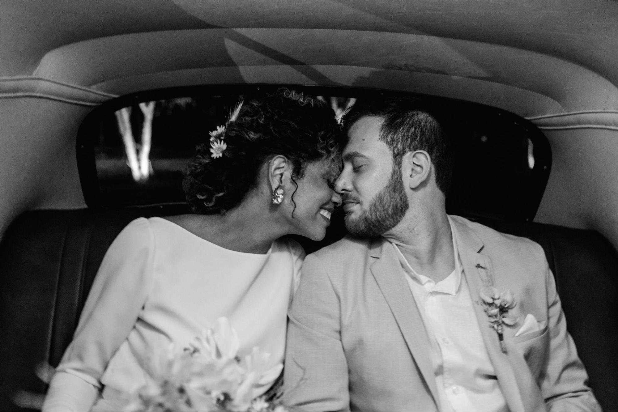 A newly married couple in a limousine